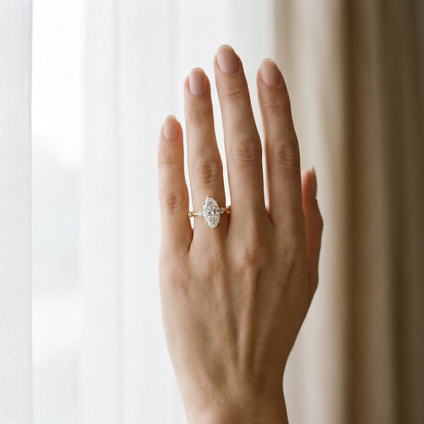 Yellow gold Marquise Solitaire Diamond Ring with Bezel Set Side Stones and Prong Setting