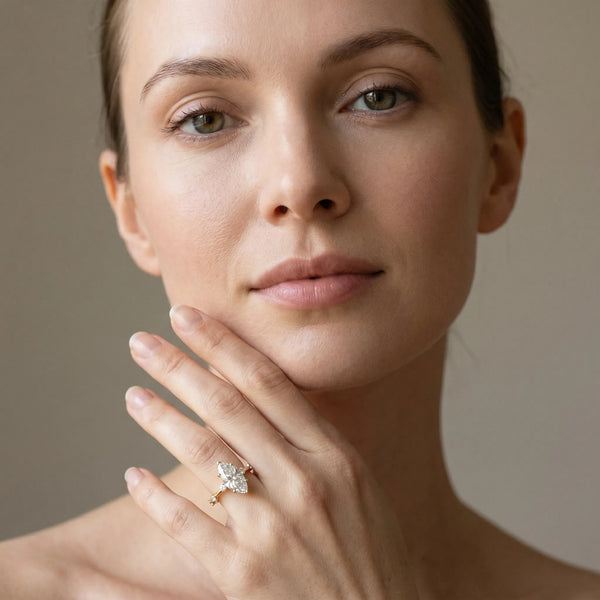 Yellow gold Marquise Solitaire Diamond Ring with Bezel Set Side Stones and Prong Setting