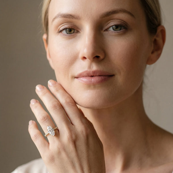 Yellow gold Marquise Solitaire Diamond Ring with Four-Prong Setting on a Plain Band