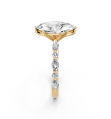10K Yellow Gold 4.03 Carat E VVS2 Marquise Solitaire with Side Stones on a Pavé Band and Four-Prong Setting