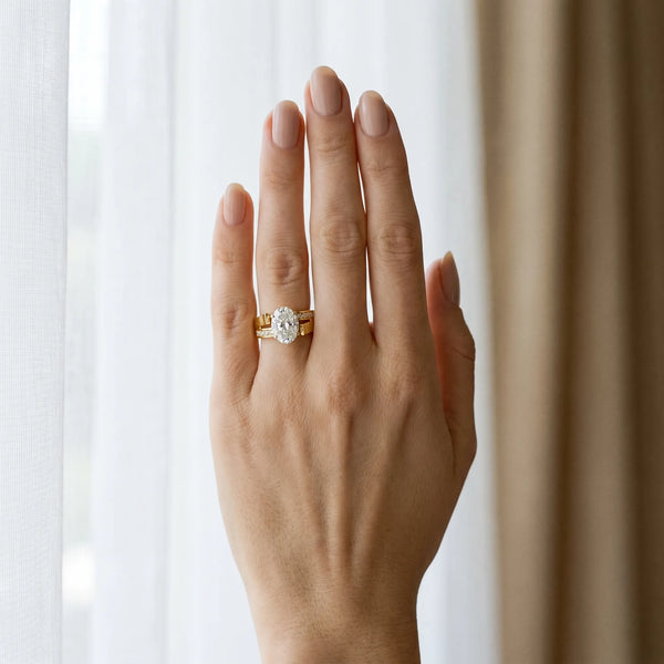Yellow gold Modern Tension Set Oval Cut Diamond Solitaire Wide Band Ring