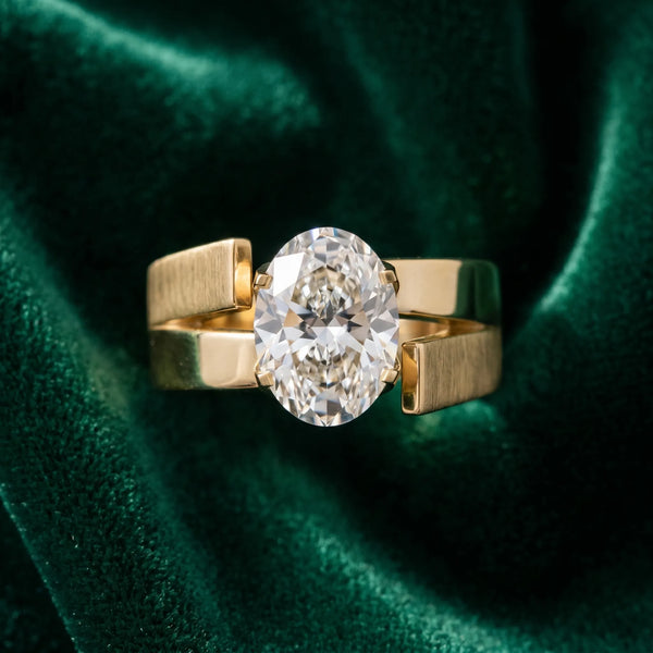 Yellow gold Modern Tension Set Oval Cut Diamond Solitaire Wide Band Ring