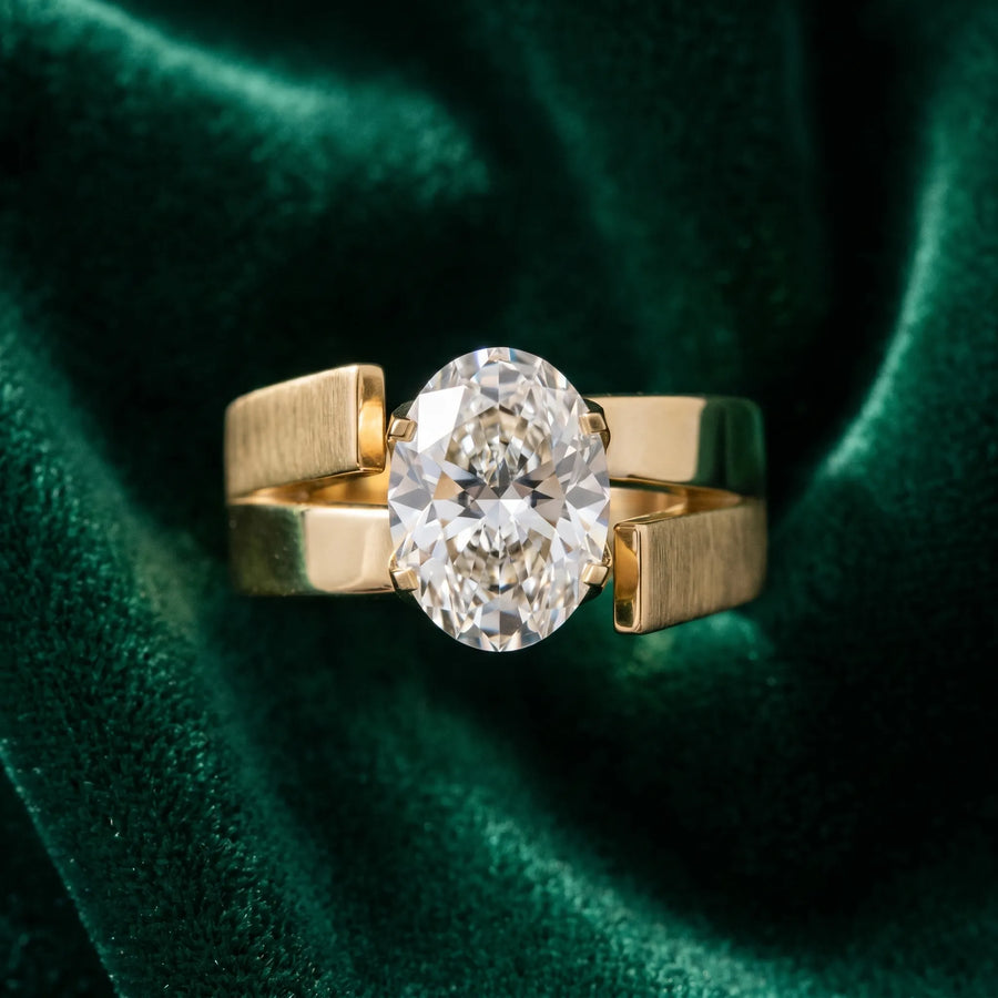 Yellow gold Modern Tension Set Oval Cut Diamond Solitaire Wide Band Ring