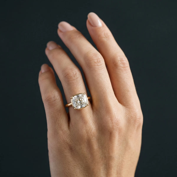 Yellow gold Old Mine Elongated Cushion Diamond East-West Bezel Set Four Claw Solitaire Ring