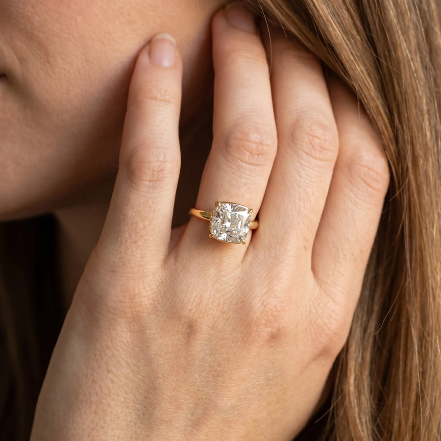 Yellow gold Old Mine Elongated Cushion Diamond East-West Bezel Set Four Claw Solitaire Ring