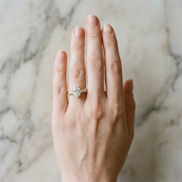 Yellow gold Oval Brilliant Cut Diamond Five-Stone Prong Set Engagement Ring with Channel Band
