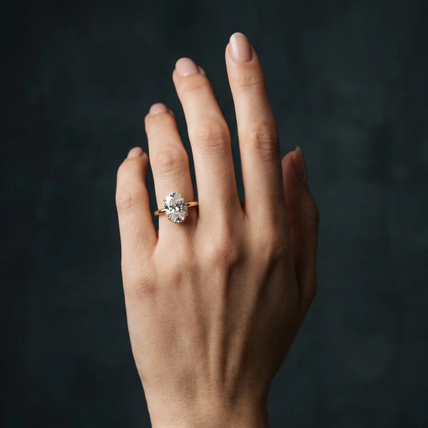 Yellow gold Oval Brilliant Solitaire Engagement Ring with Six-Prong Setting and Classic Band