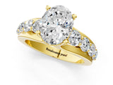 Yellow gold Oval Brilliant Solitaire with Side Stones on a Pave Band and Four-Prong Setting_25