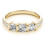 Yellow gold Oval Brilliant Trilogy Channel Set Diamond Ring with Bar Prongs 1