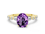 Yellow gold Oval Cut Amethyst Solitaire with Side Stones on a Pavé Band and Four-Prong Setting