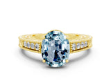 Yellow gold Oval Cut Aquamarine Engagement Ring with Milgrain Channel Set Band and Prong Setting
