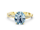 Yellow gold Oval Cut Aquamarine Engagement Ring with Side Stone Accents and Four-Prong Setting_60