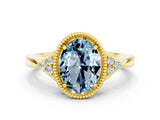 Yellow gold Oval Cut Aquamarine Halo Ring with Tapered Band and Four-Prong Setting