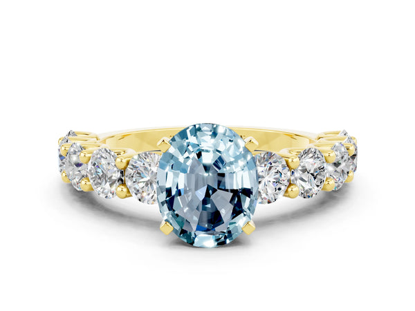 Yellow gold Oval Cut Aquamarine Prong Setting with Side Stones on a Pave Band