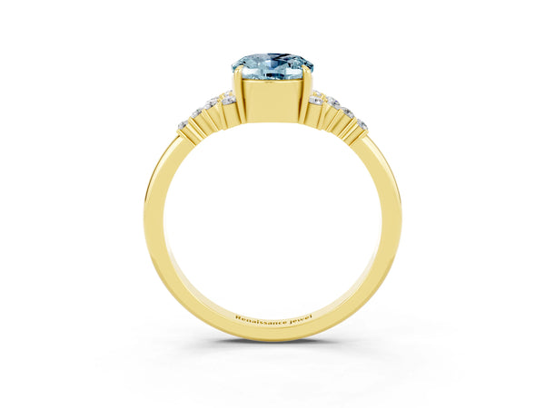 Yellow gold Oval Cut Aquamarine Ring with Side Stones and Four-Prong Setting