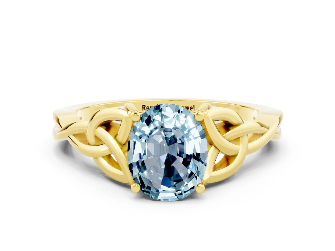 Yellow gold Oval Cut Aquamarine Solitaire Engagement Ring with Celtic Knot Band and Four-Prong Setting