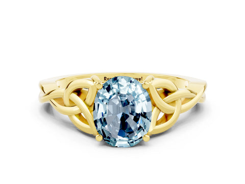 Yellow gold Oval Cut Aquamarine Solitaire Engagement Ring with Celtic Knot Band and Four-Prong Setting
