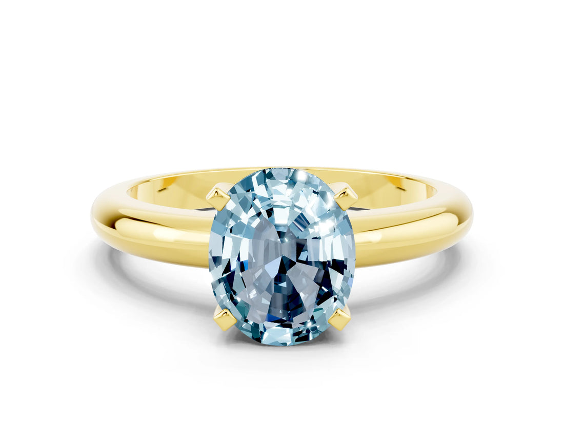 Yellow gold Oval Cut Aquamarine Solitaire Engagement Ring with Round Band and Four-Prong Setting