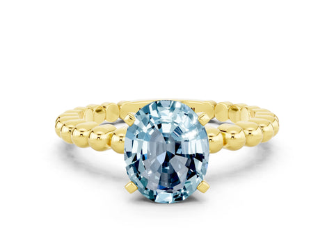 Yellow gold Oval Cut Aquamarine Solitaire Ring with Beaded Band and Prong Setting