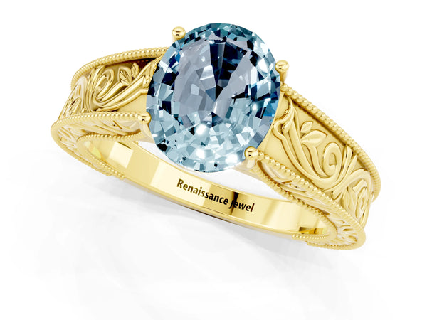 Yellow gold Oval Cut Aquamarine Solitaire Ring with Engraved Band and Four-Prong Setting