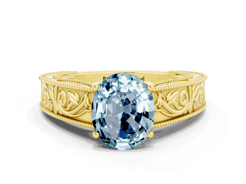 Yellow gold Oval Cut Aquamarine Solitaire Ring with Engraved Band and Four-Prong Setting