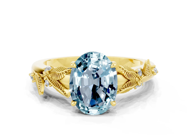 Yellow gold Oval Cut Aquamarine Solitaire Ring with Leaf Motif Band and Four-Prong Setting