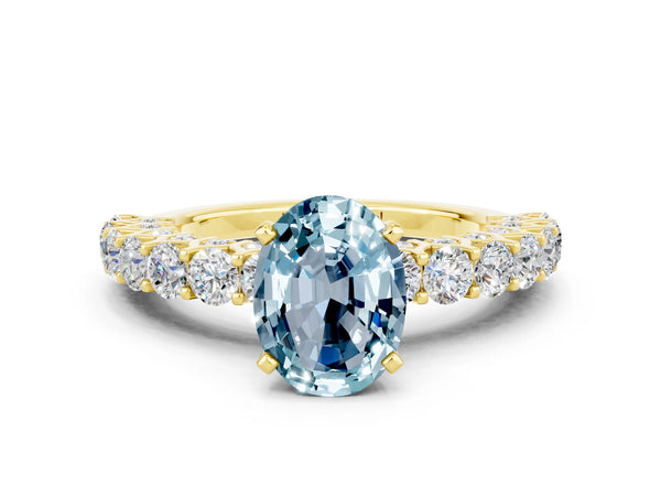Yellow gold Oval Cut Aquamarine Solitaire Ring with Shared Prong Pavé Band and Four-Prong Setting