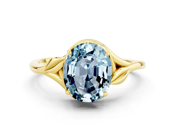 Yellow gold Oval Cut Aquamarine Solitaire Ring with Twist Band and Four-Prong Setting