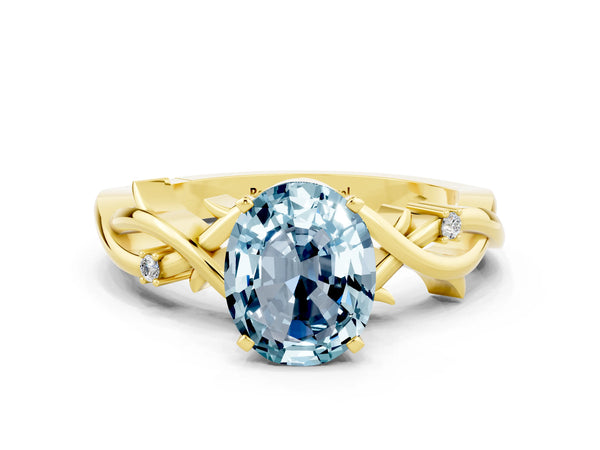 Yellow gold Oval Cut Aquamarine Solitaire Ring with Twisted Band and Prong Setting