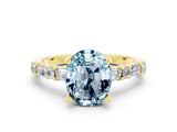 Yellow gold Oval Cut Aquamarine Solitaire with Side Baguettes and Channel Set Band