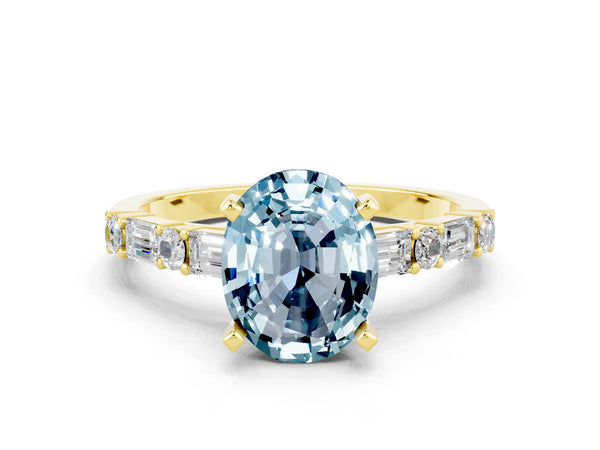 Yellow gold Oval Cut Aquamarine Solitaire with Side Baguettes and Channel Set Band
