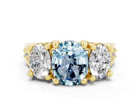 Yellow gold Oval Cut Aquamarine Three-Stone Ring with Channel Set Band and Four-Prong Setting