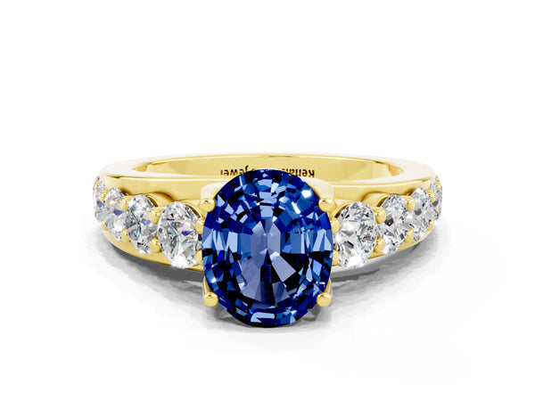 Yellow gold Oval Cut Blue Sapphire Engagement Ring with Pavé Band and Four-Prong Setting