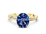 Yellow gold Oval Cut Blue Sapphire Engagement Ring with Side Stone Accents and Four-Prong Setting_27