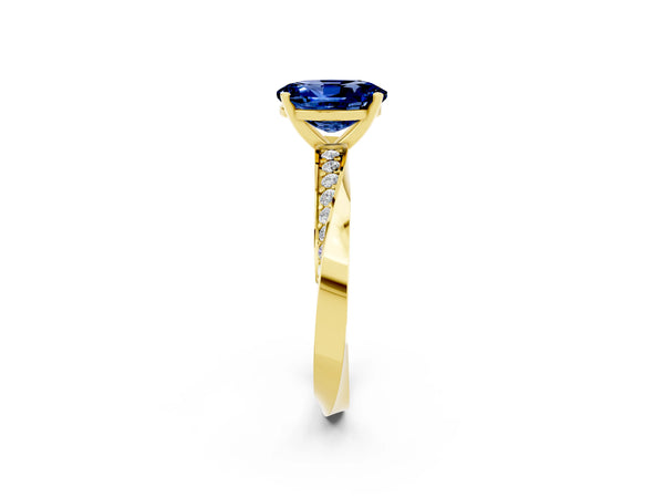 Yellow gold Oval Cut Blue Sapphire Engagement Ring with Side Stone Accents and Four-Prong Setting