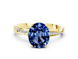 Yellow gold Oval Cut Blue Sapphire Engagement Ring with Side Stone Accents and Four-Prong Setting_60