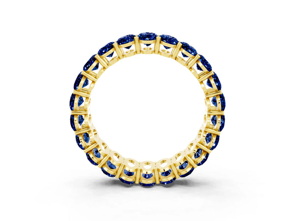 Yellow gold Oval Cut Blue Sapphire Eternity Band with Shared Prong Setting