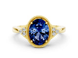 Yellow gold Oval Cut Blue Sapphire Halo Ring with Tapered Band and Four-Prong Setting_48