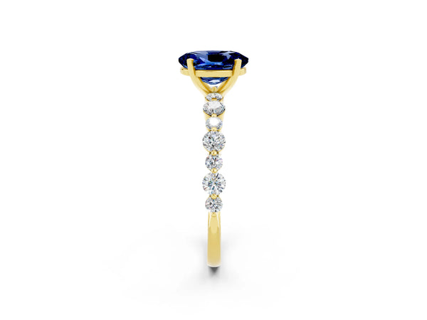 Yellow gold Oval Cut Blue Sapphire Prong Set Engagement Ring with Pavé Band