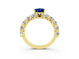 Yellow gold Oval Cut Blue Sapphire Prong Setting with Side Stones on a Pave Band_3