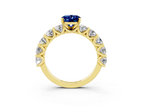 Yellow gold Oval Cut Blue Sapphire Prong Setting with Side Stones on a Pave Band_3
