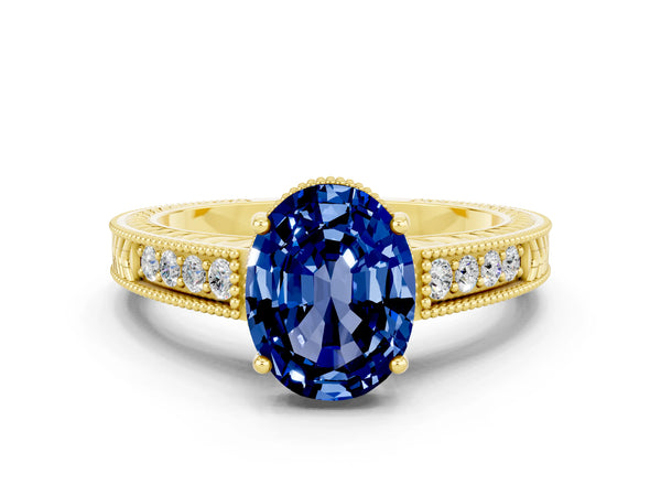 Yellow gold Oval Cut Blue Sapphire Ring with Milgrain Pavé Band and Four-Prong Setting