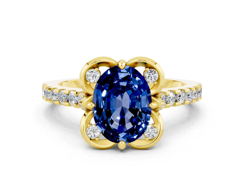 Yellow gold Oval Cut Blue Sapphire Ring with Pavé Band and Floral Prong Setting
