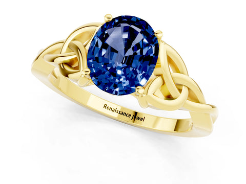 Yellow gold Oval Cut Blue Sapphire Solitaire Engagement Ring with Celtic Knot Band and Four-Prong Setting_1