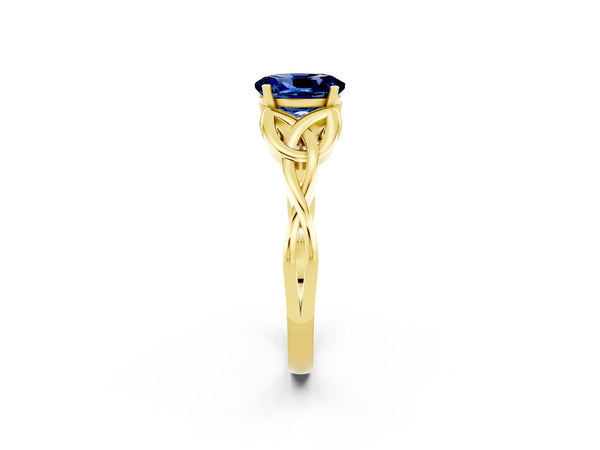Yellow gold Oval Cut Blue Sapphire Solitaire Engagement Ring with Celtic Knot Band and Four-Prong Setting