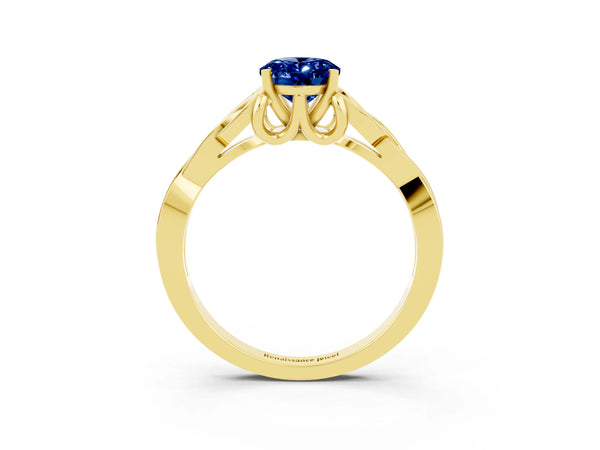 Yellow gold Oval Cut Blue Sapphire Solitaire Engagement Ring with Celtic Knot Band and Four-Prong Setting