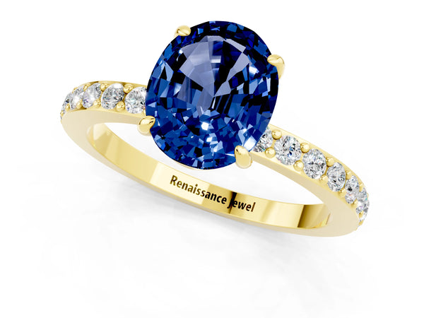 Yellow gold Oval Cut Blue Sapphire Solitaire Engagement Ring with Pavé Band and Four-Prong Setting