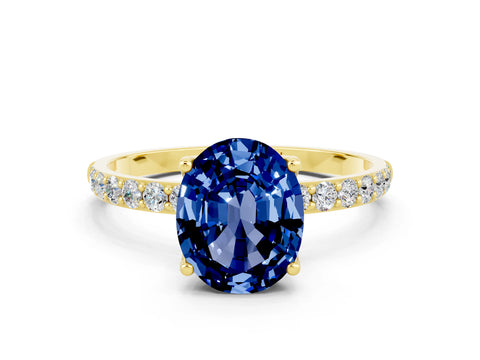 Yellow gold Oval Cut Blue Sapphire Solitaire Engagement Ring with Pavé Band and Prong Setting