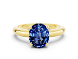 Yellow gold Oval Cut Blue Sapphire Solitaire Engagement Ring with Round Band and Four-Prong Setting