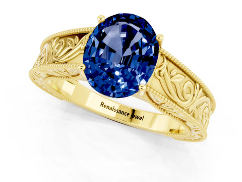 Yellow gold Oval Cut Blue Sapphire Solitaire Ring with Engraved Band and Four-Prong Setting_1